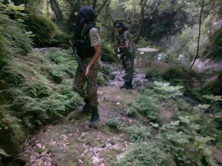 Two Libyan fighters in the lush forests of rural Latakia