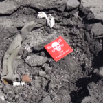 A crater in northern Khan Sheikhoun that was allegedly the site of the sarin release on April 4, 2017. Source screenshot from SMART News video, April 6, 2017