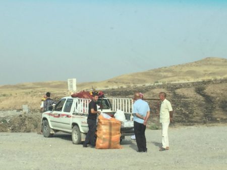 HRW witnesses KDP asa’ish preventing a Yazidi civilian family from bringing rice and pillows for their own use into Sinjar. Photo: 2016 Belkis Wille/Human Rights Watch