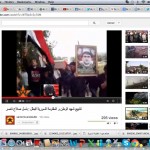 Mourners hold Basil’s portrait and wave the flag of Syria